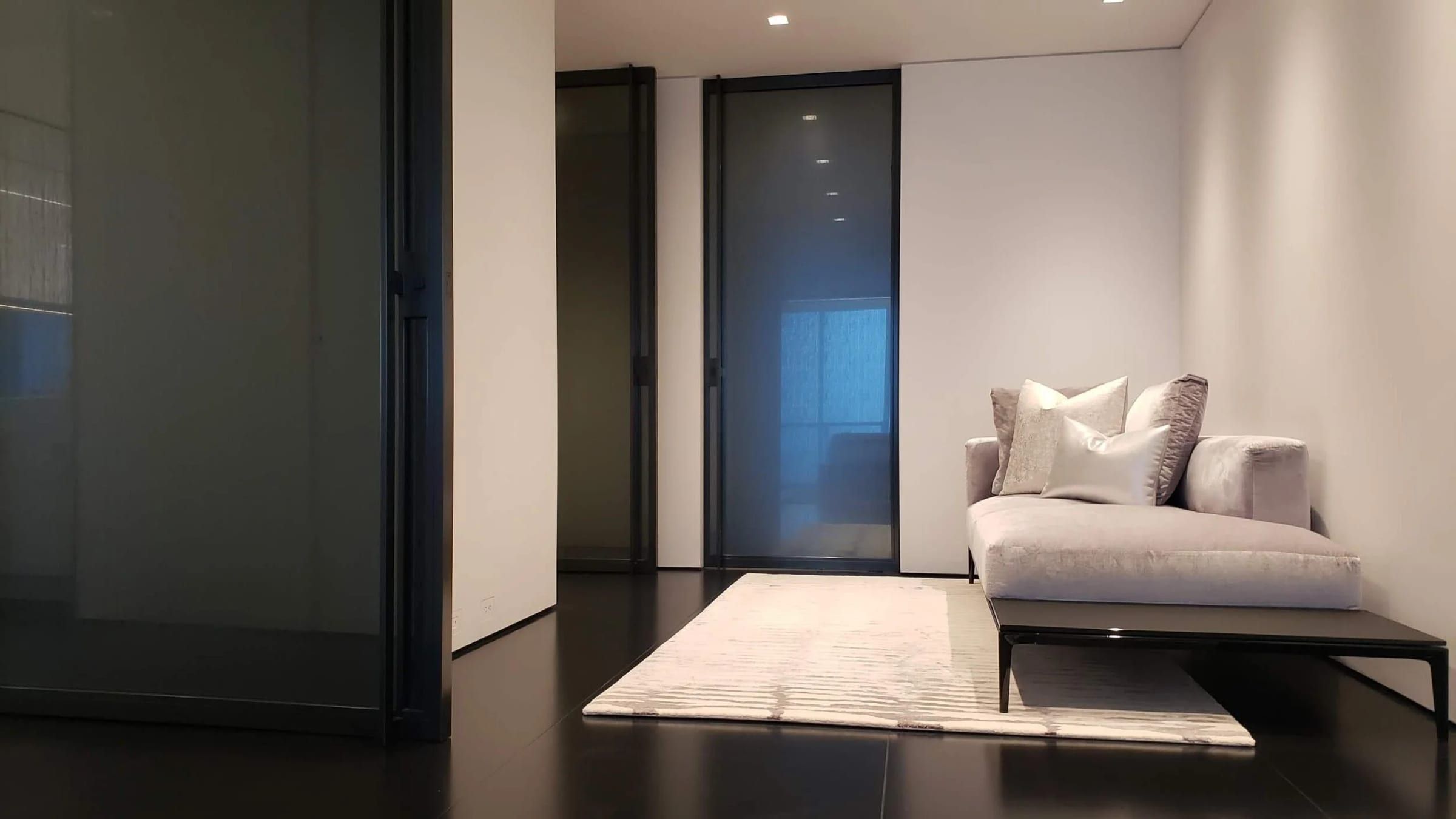 Blackened stainless door seen from a lounge