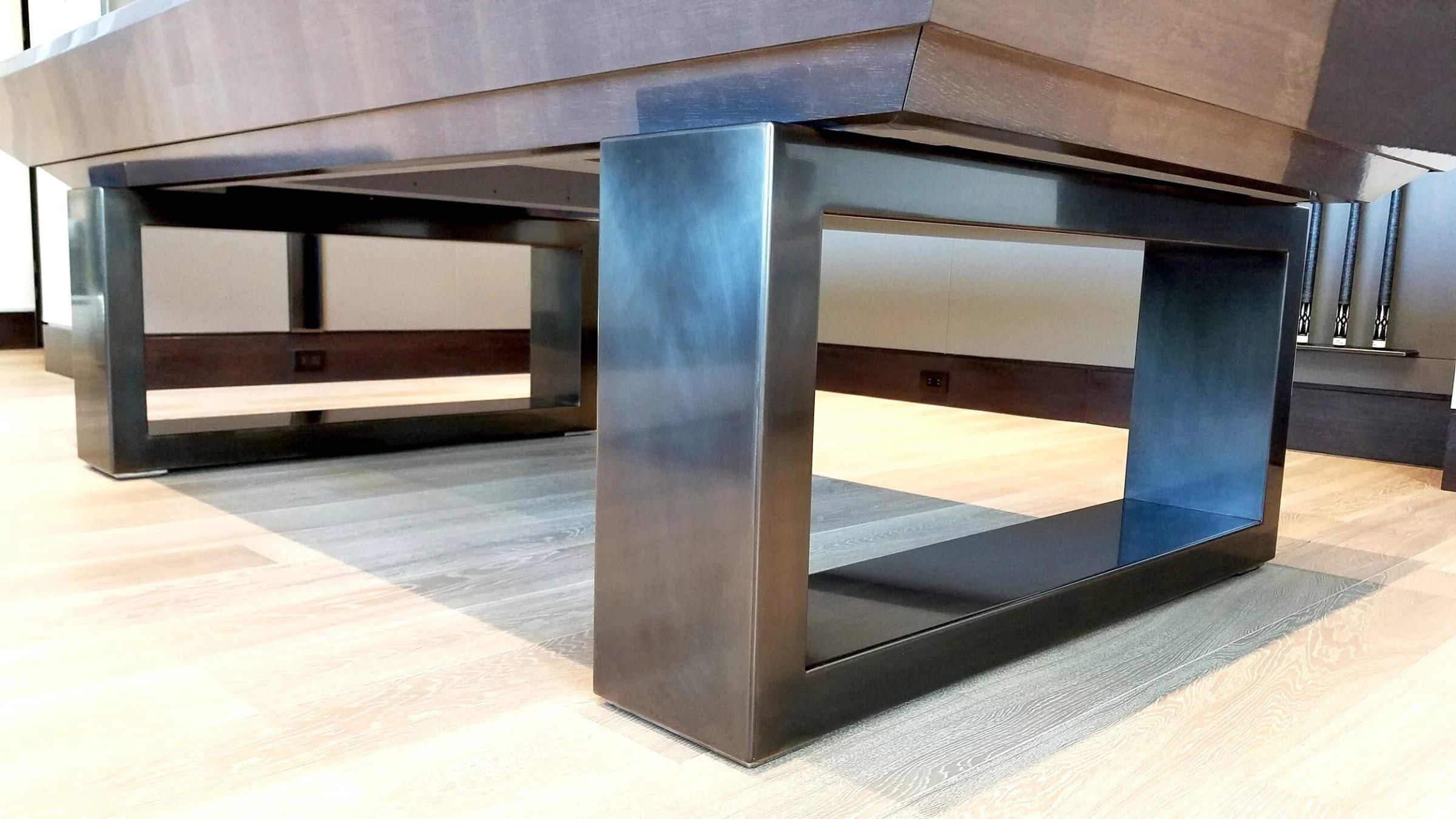 Blackened steel table base, close detail