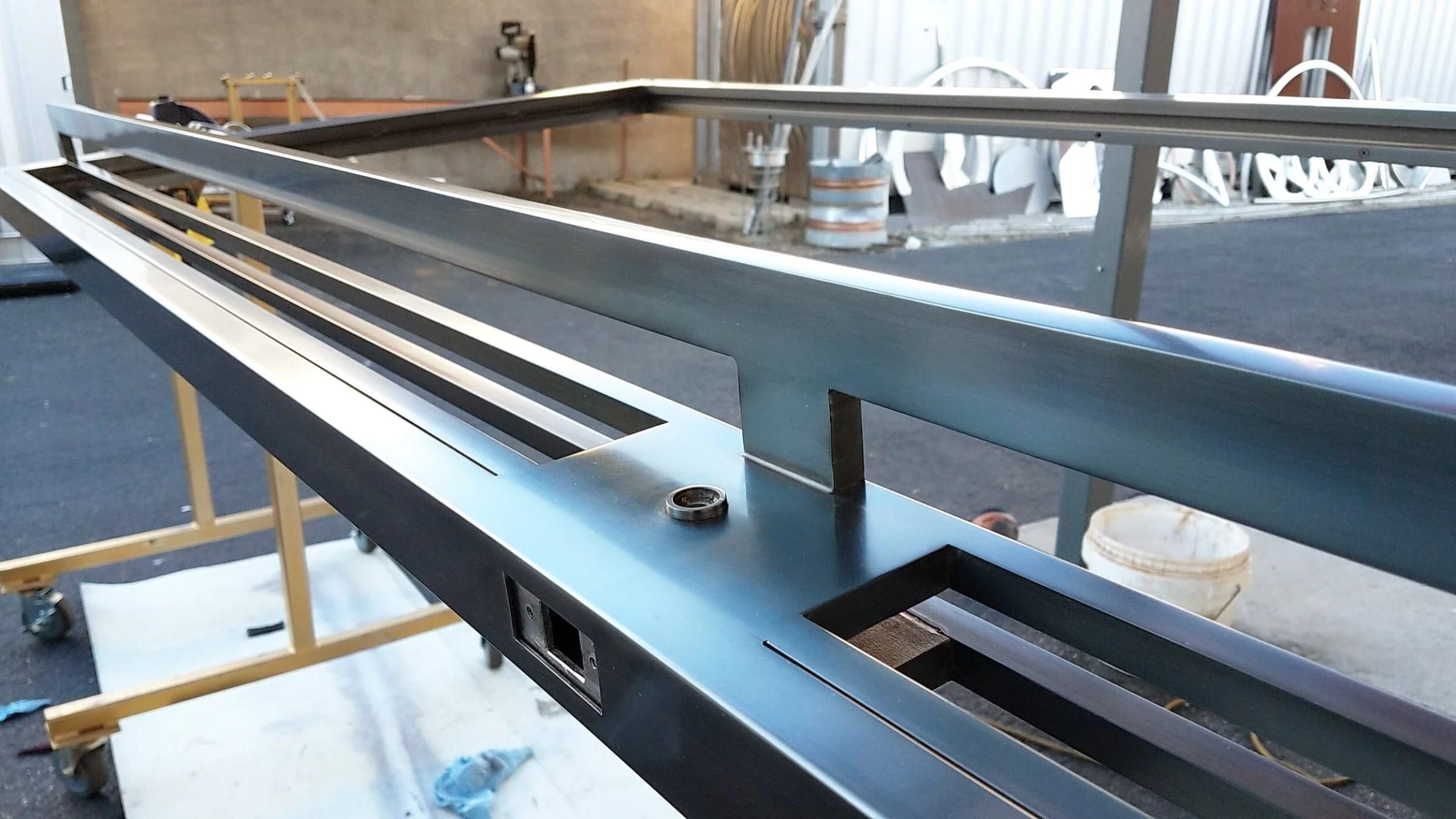 Steel member with cut openings on the shop floor